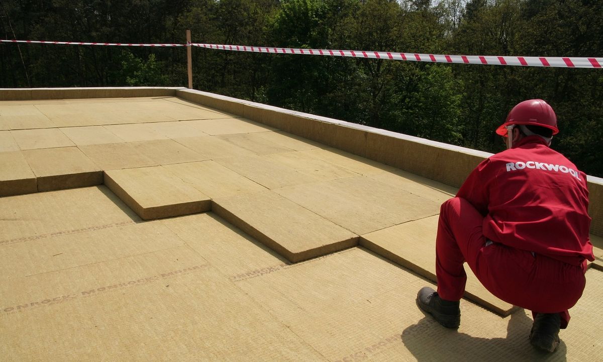 Rockwool being installed on a flat roof